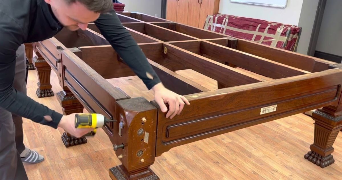 Tighten and attach the pool table legs