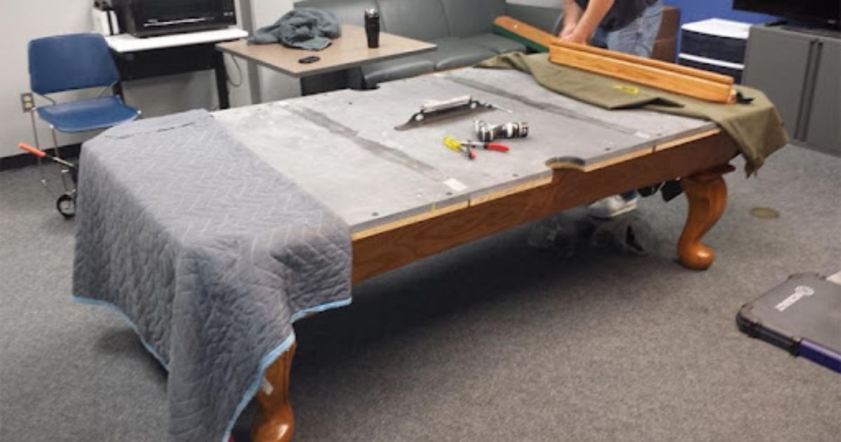 Applying the felt on the table bed